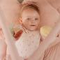 Preview: Baby liegt auf rosa Spieldecke mit Greifanhängern in Blüten-Optik von Little Dutch