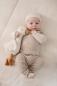 Preview: Baby spielt mit Kuschelgans Little Goose 25 cm