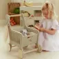 Preview: Kind spielt mit Little Dutch Holz-Einkaufswagen in Grün am Marktstand