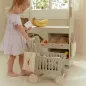Preview: Kind schiebt den grünen Little Dutch Holz-Einkaufswagen beim Spielen